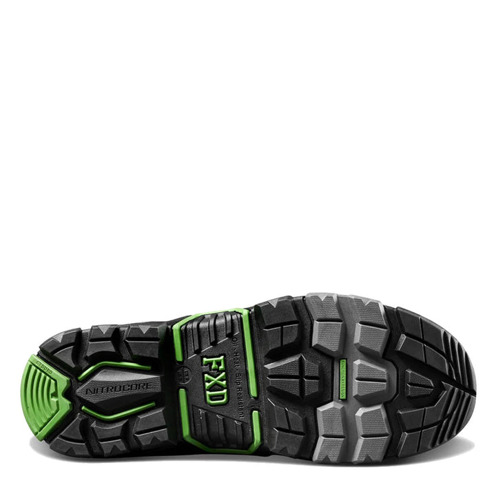 A close-up bottom view of a black boot sole with green accents, showing the tread pattern and branding.