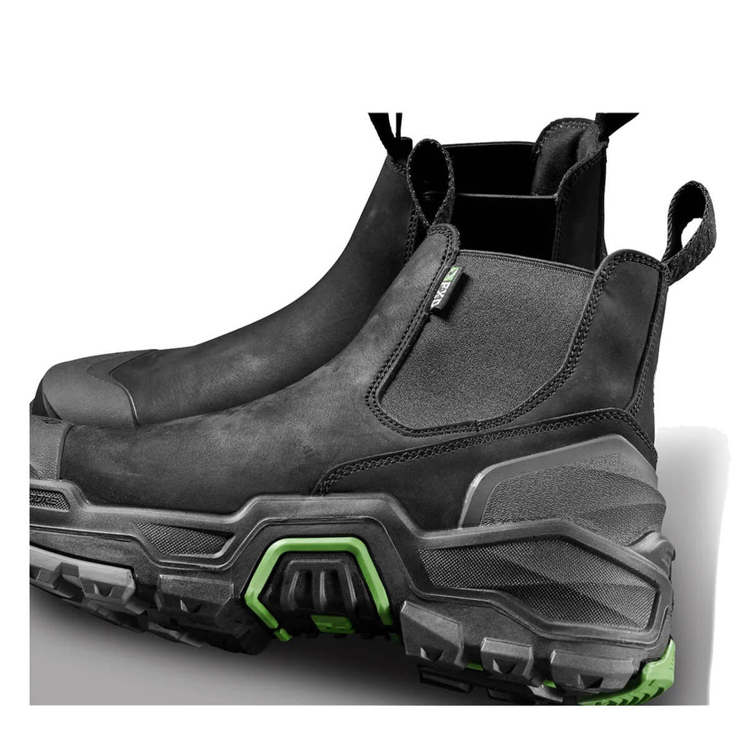 A pair of black boots with chunky soles featuring green accents, shown on a white background.